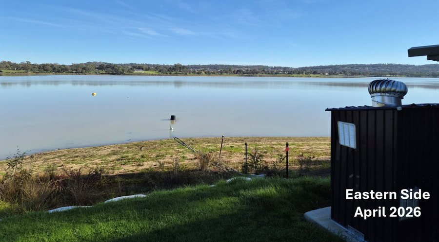 A Hydro2050 cabinet installed on the eastern shore of Lake Albert, lines running down the bank into the water